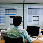 영화 제작사에서의 첫 직장 생활 - **Prompt:** A young, eager film production intern, in their early 20s, wearing smart-casual attire (...